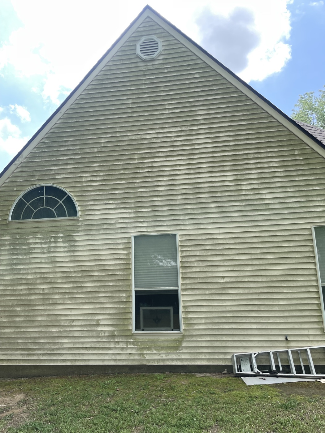 House siding before pressure washing